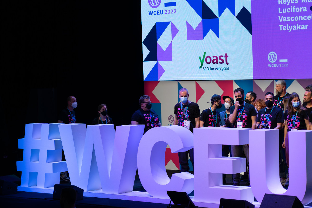 WCEU stage showing WCEU hashtag and a few organisers behind
