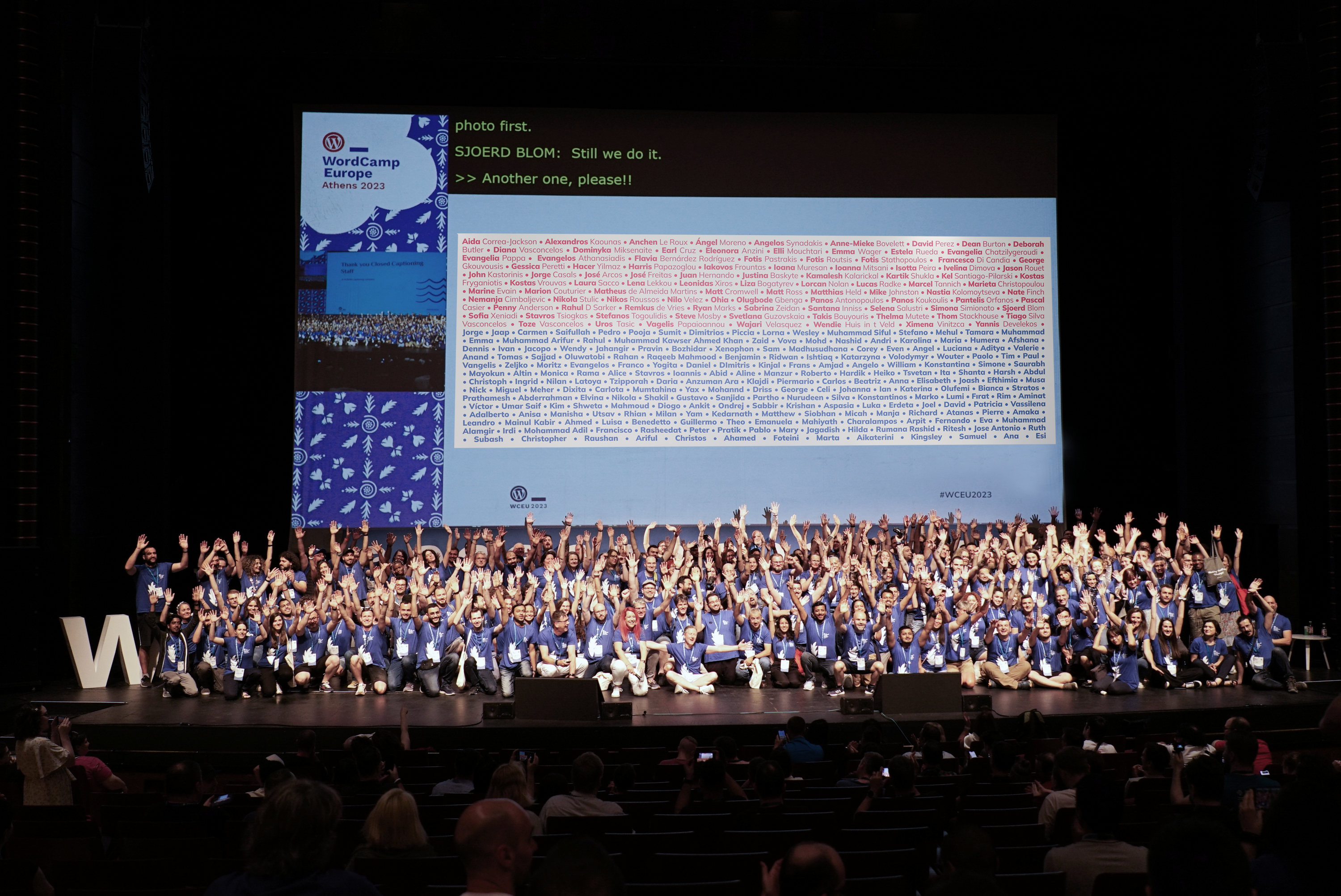 Image of the WordCamp Europe 2023 stage with the organising and volunteers team on stage.